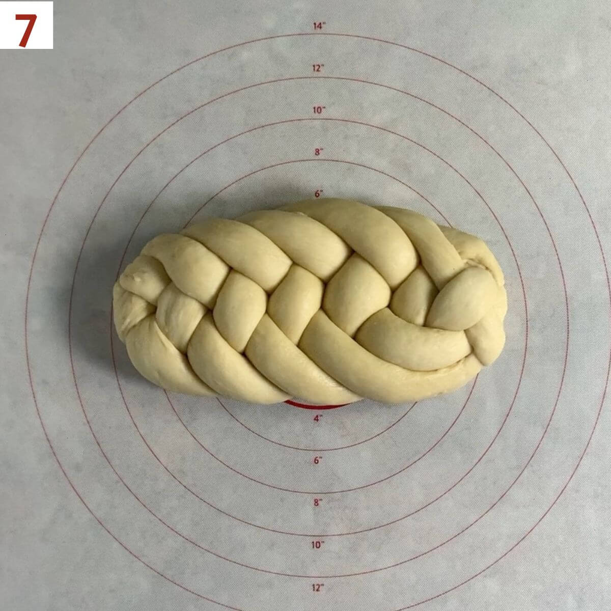 A finished flat 6-strand braided challah.