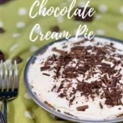 Chocolate Cream Pie with 2 forks surrounded by chocolate on a green polka dot towel Pinterest banner.