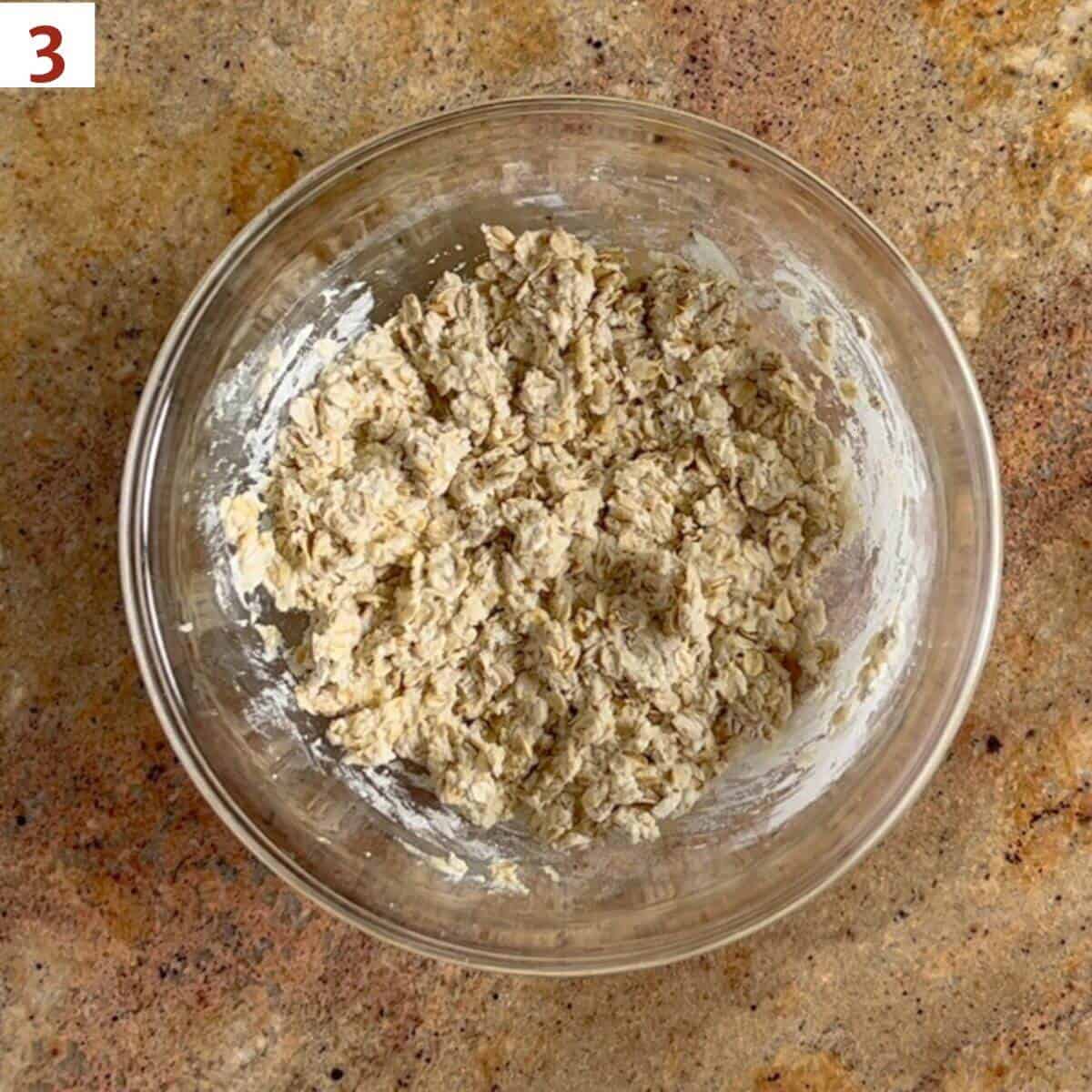 Finished dough in a glass bowl from overhead.