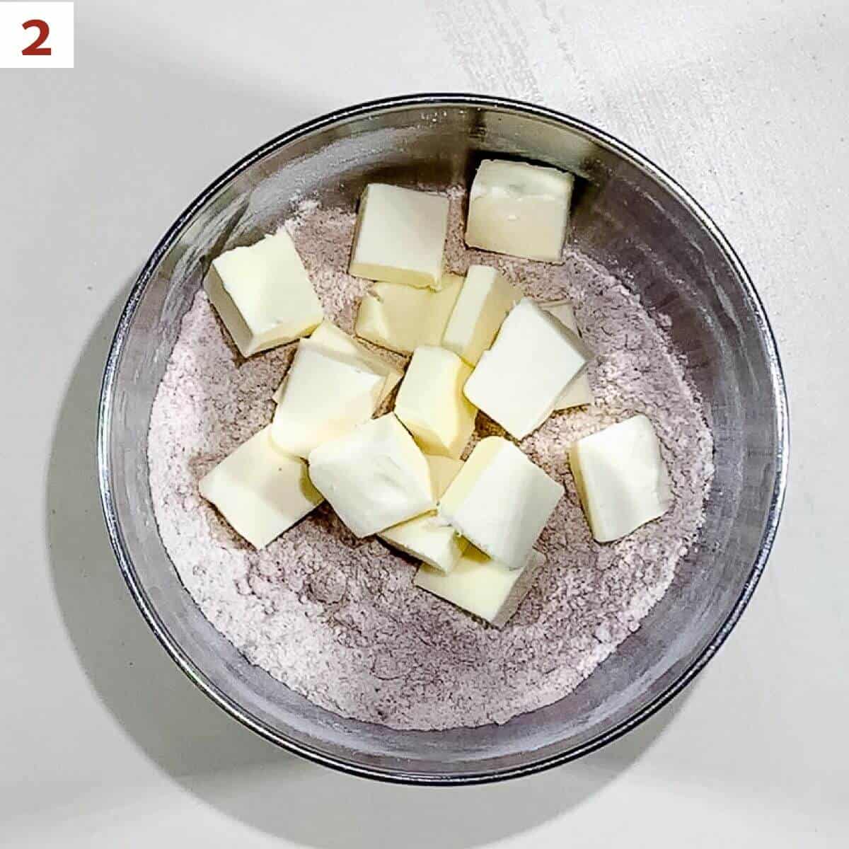 Cutting in the butter to the streusel dry ingredients.