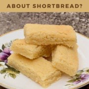 Scottish shortbread on white china plate Pinterest banner.