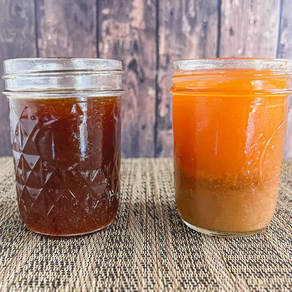 Two jars of boiled apple cider side by side, comparing properly made syrup vs. syrup with sediment.