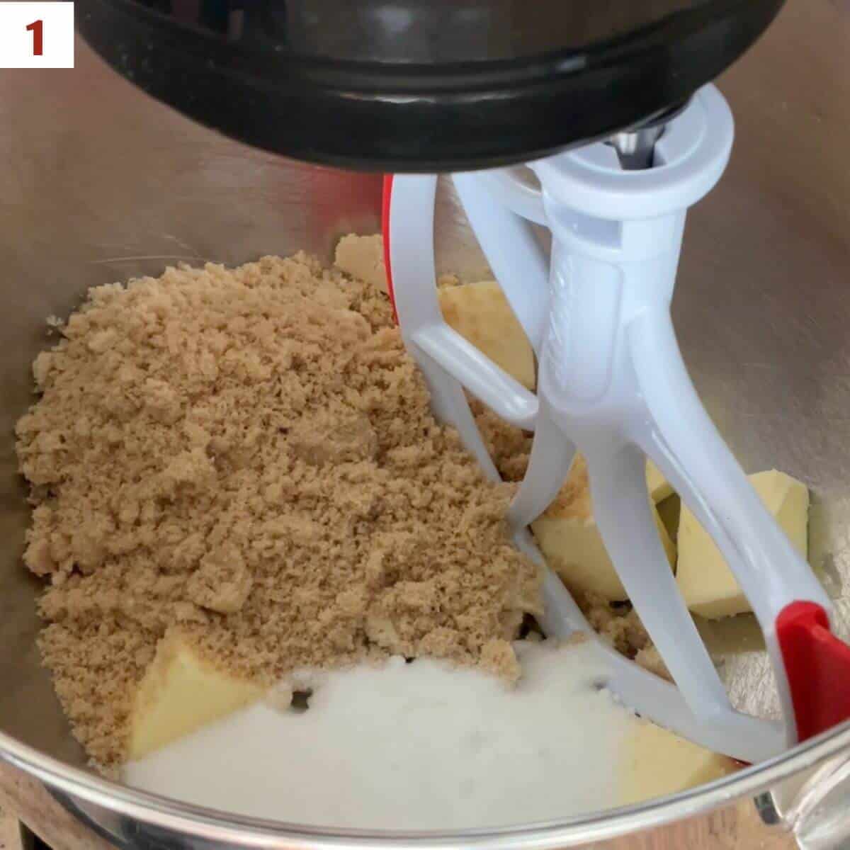 Butter, sugar, and brown sugar in a stand mixer bowl.