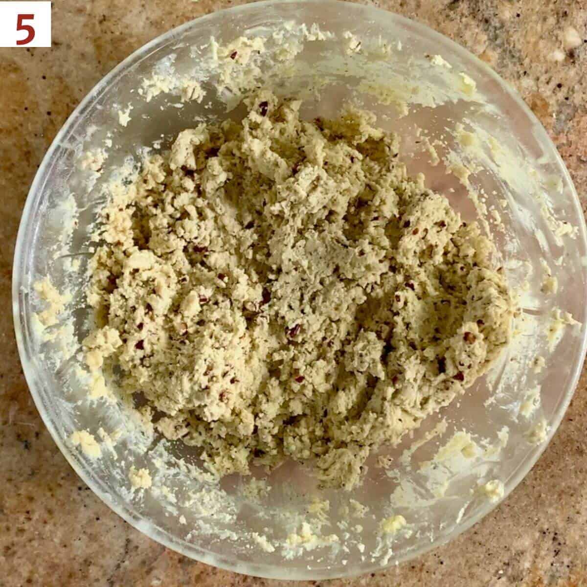 Finished cookie dough in a glass bowl.