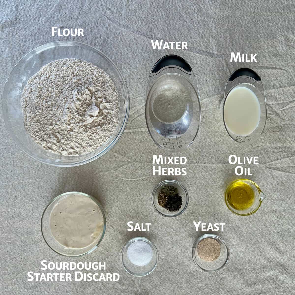 Ingredients for sourdough ciabatta rolls portioned into glass bowls.