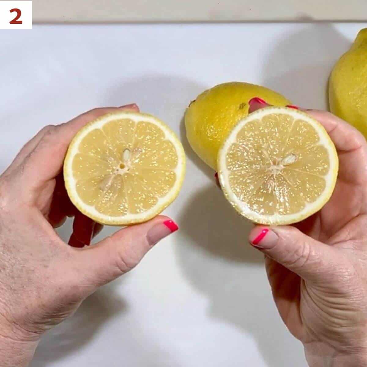 Showing the two cut halves of a lemon over a cutting board.