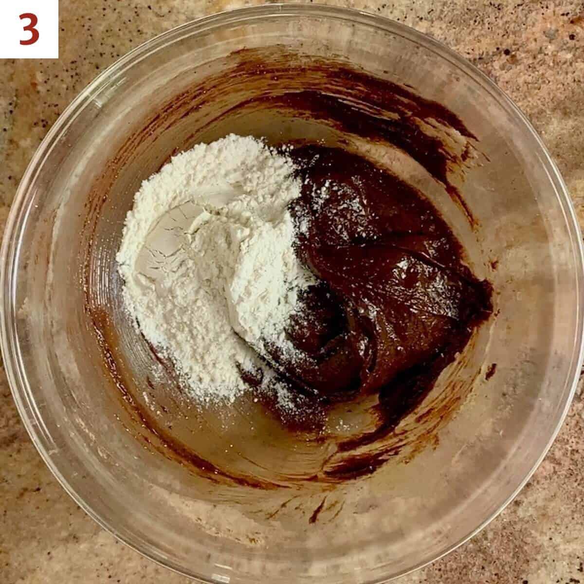 Adding flour into brownie batter