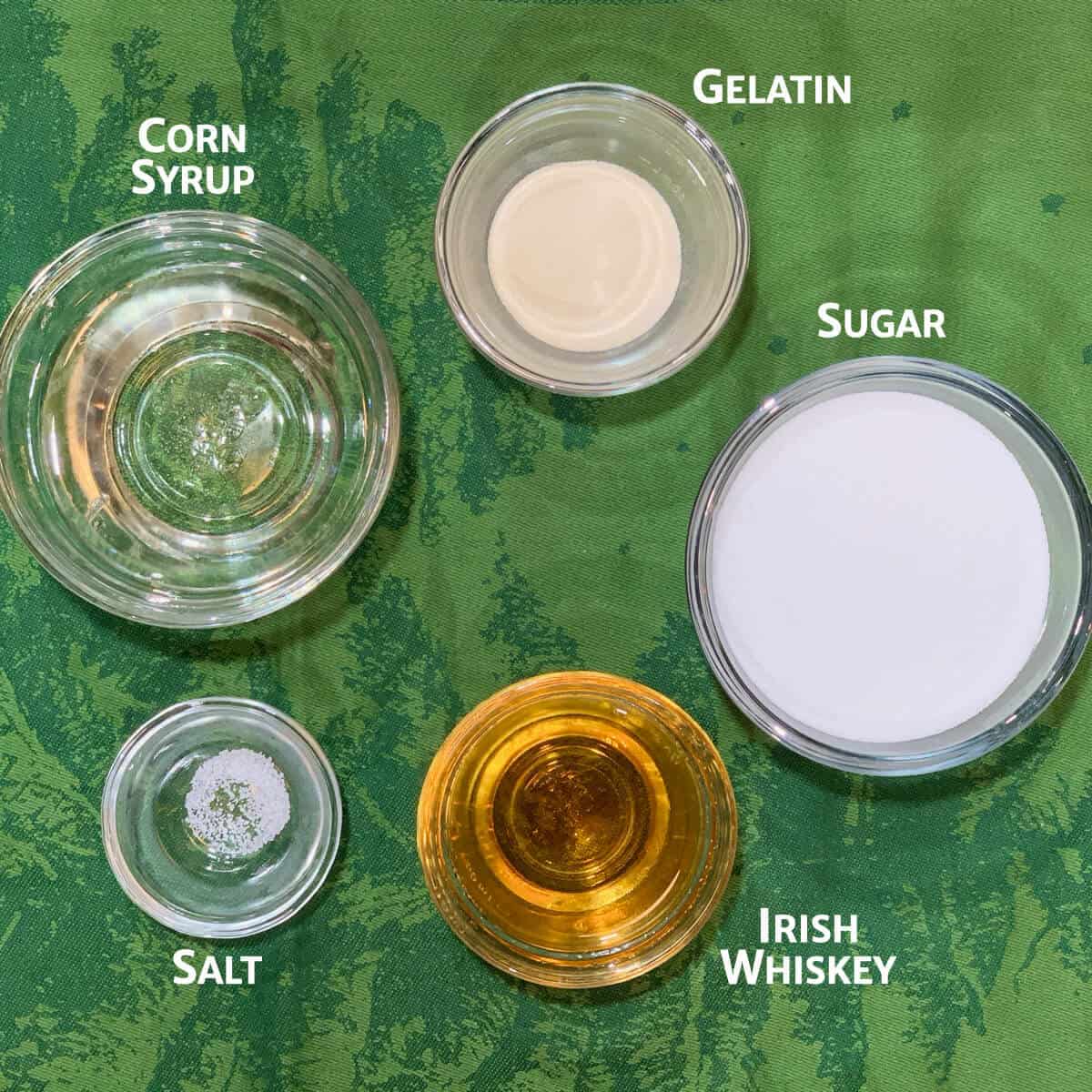 Whiskey marshmallow ingredients portioned into glass bowls.