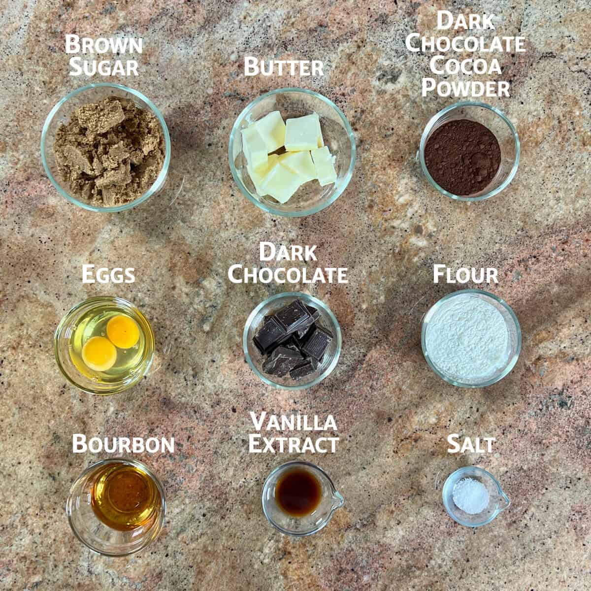 Bourbon brownie ingredients portioned into glass bowls from overhead.