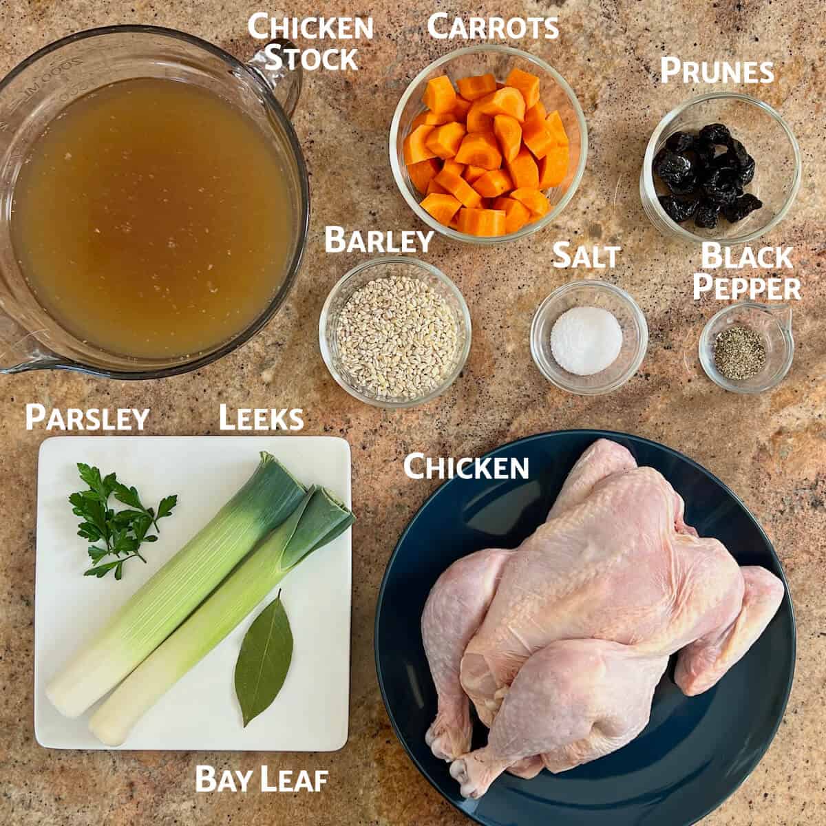 Ingredients for cock-a-leekie soup portioned into glass bowls or plates.