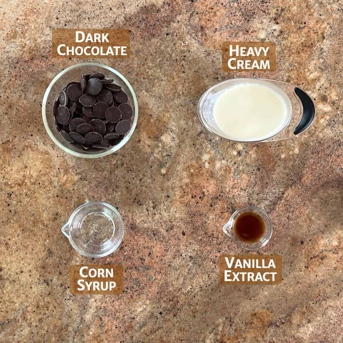Ingredients for chocolate ganache portioned into glass bowls from overhead.