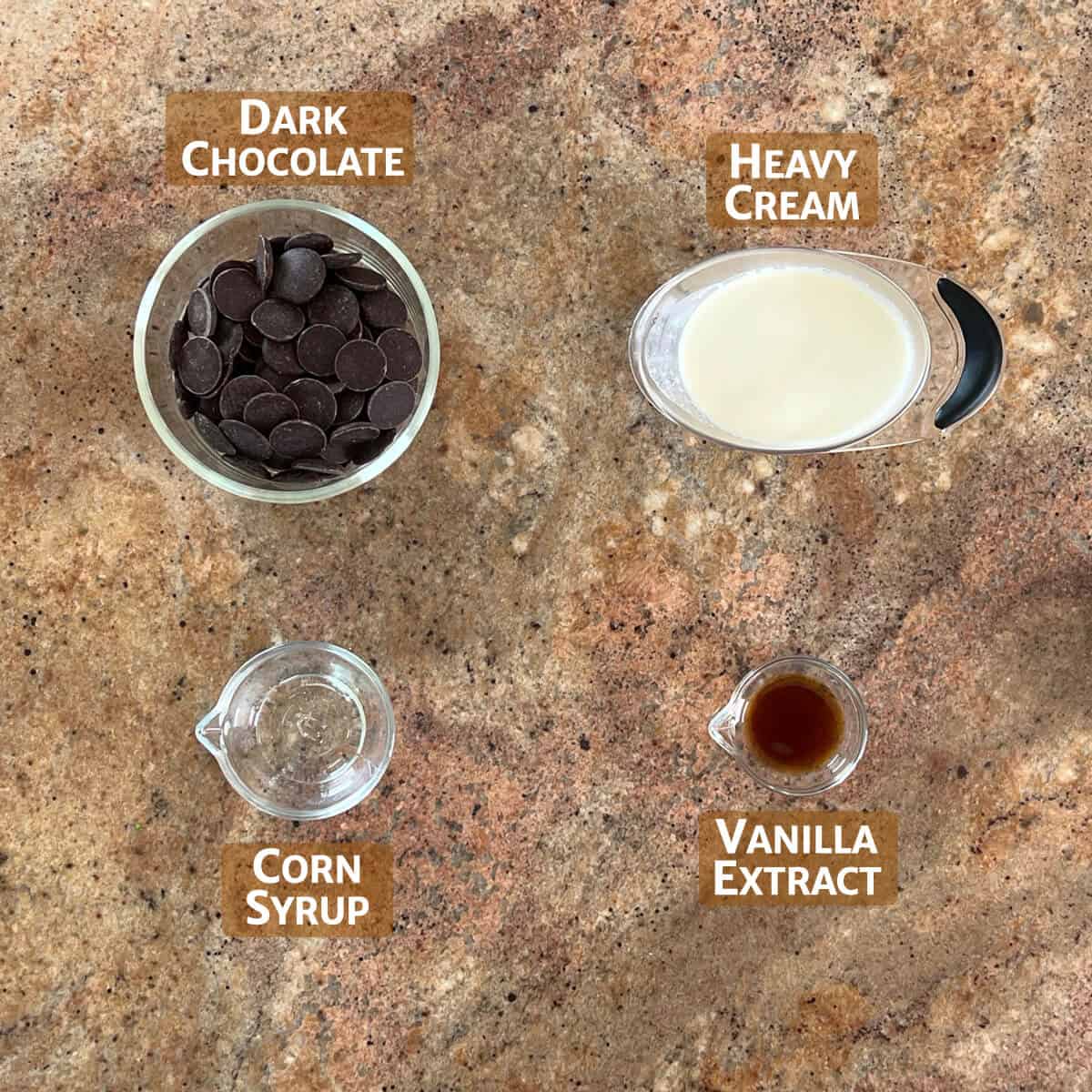 Ingredients for chocolate ganache portioned into glass bowls.