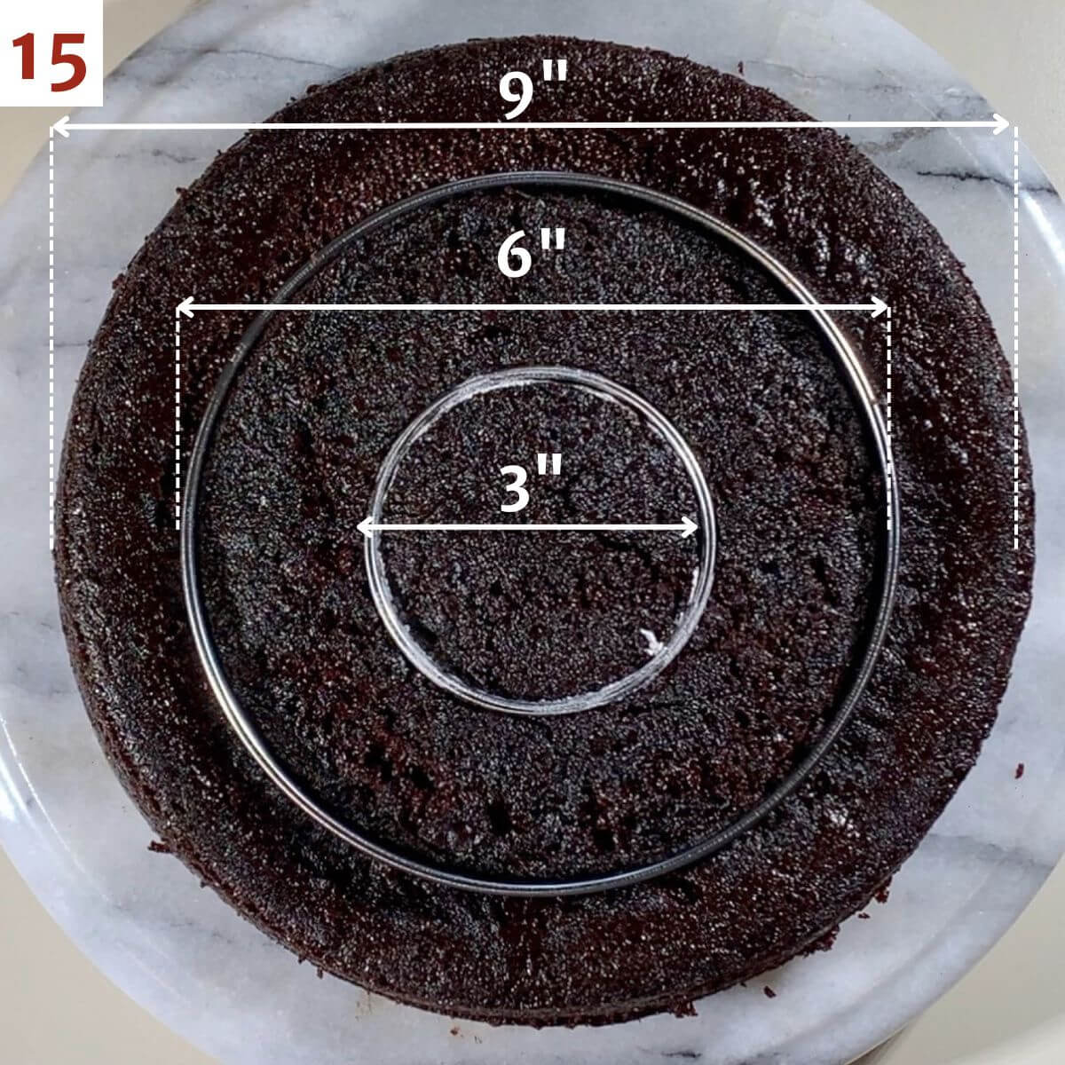 Cutting rings out of chocolate cake with cookie cutters.