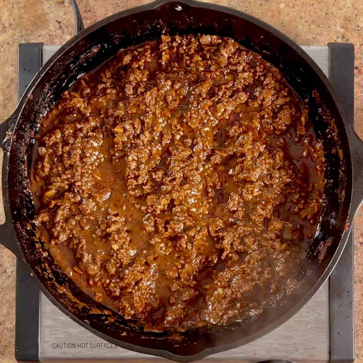 Finished Cincinnati chili in a cast iron skillet.