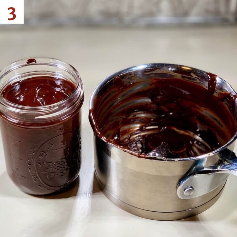 Hot fudge sauce in a jar next to empty saucepan.