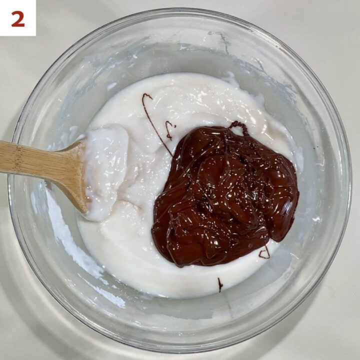 Adding chocolate into the powdered sugar mixture.