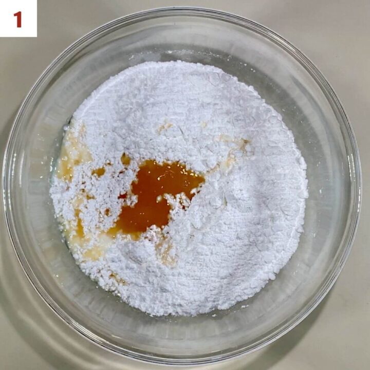 Combining whisky with powdered sugar.