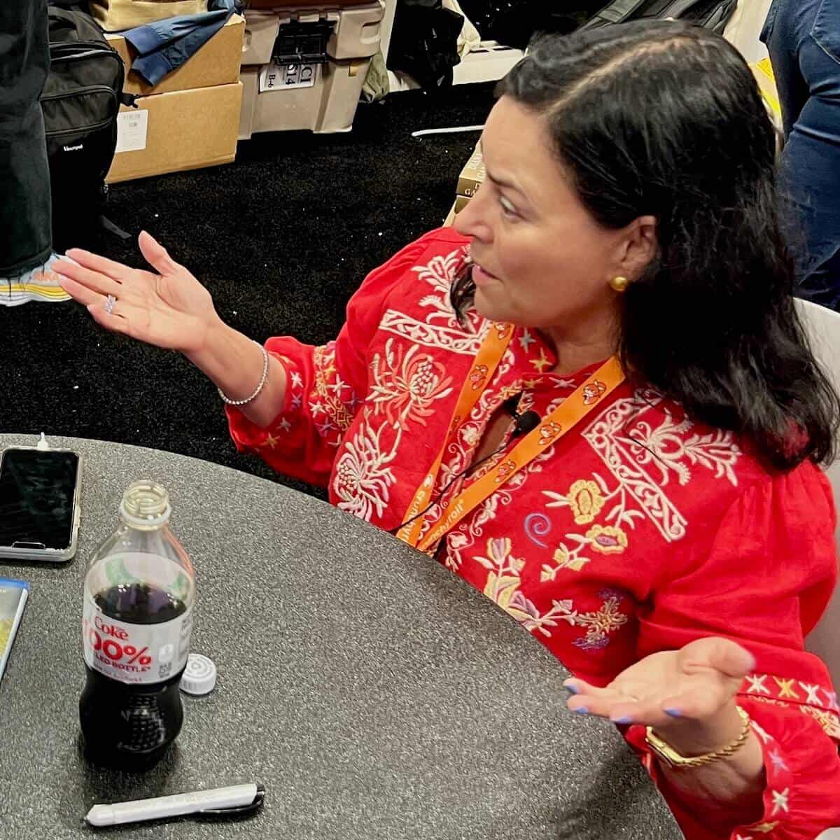 Diana Gabaldon gesturing as she sits for an interview.