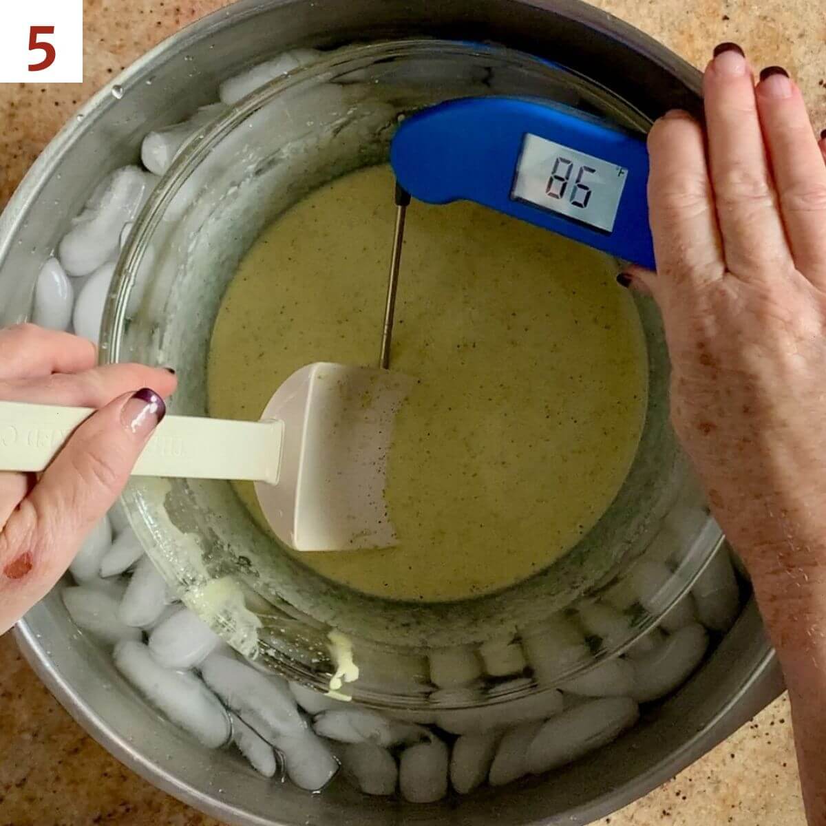 Cooling a cooked custard base in an ice bath while taking its temperature.