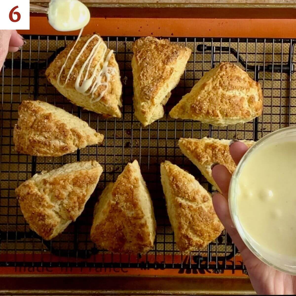 Drizzling glaze onto baked scones.