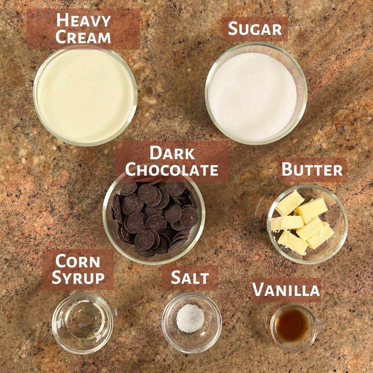 Ingredients for the caramel and chocolate ganache portioned into glass bowls.