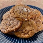 Molasses cookies on a blue plate.