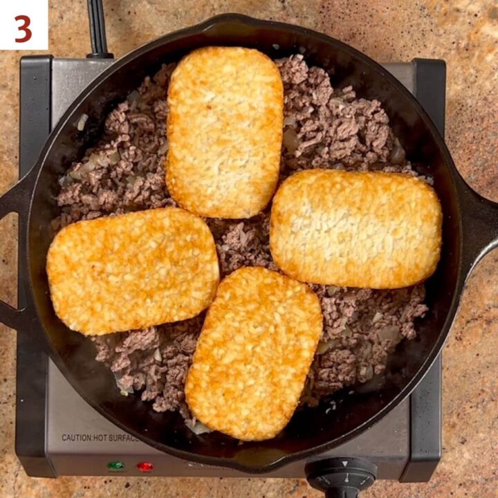 Adding hash browns to ground beef mixture.