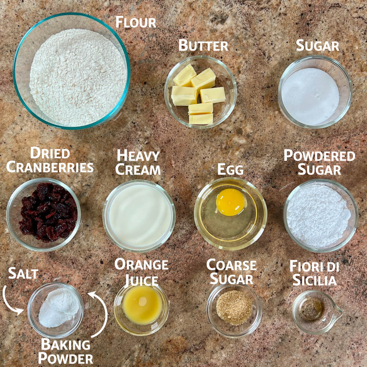 Orange Cranberry Scones ingredients portioned into glass bowls.