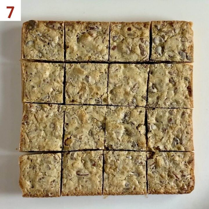 Pecan bars on a cutting board after being portioned from overhead.