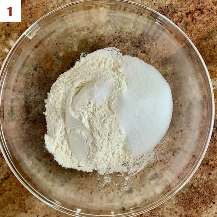 Flour, sugar, and salt in a glass bowl to make the shortbread base.