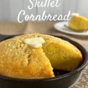 Cut cornbread topped with pat of butter in a cast iron skillet on a brown edged plate with a fork and slice on a white plate behind Pinterest banner.