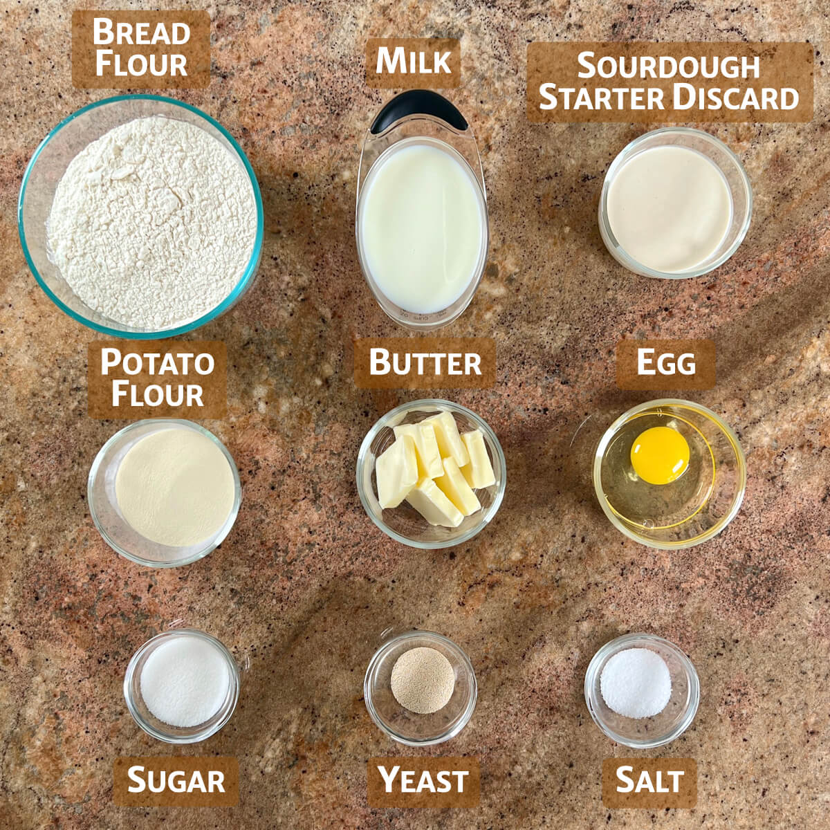 Sourdough Dinner Rolls ingredients portioned into glass bowls.