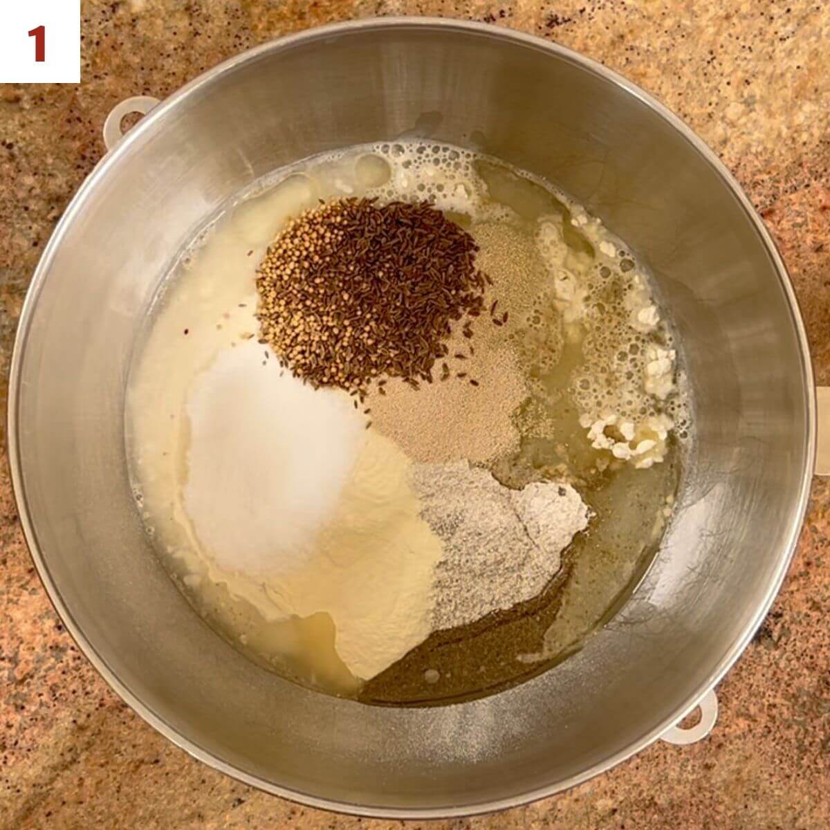 Ingredients for Sourdough Rye Sandwich Bread in a mixing bowl.