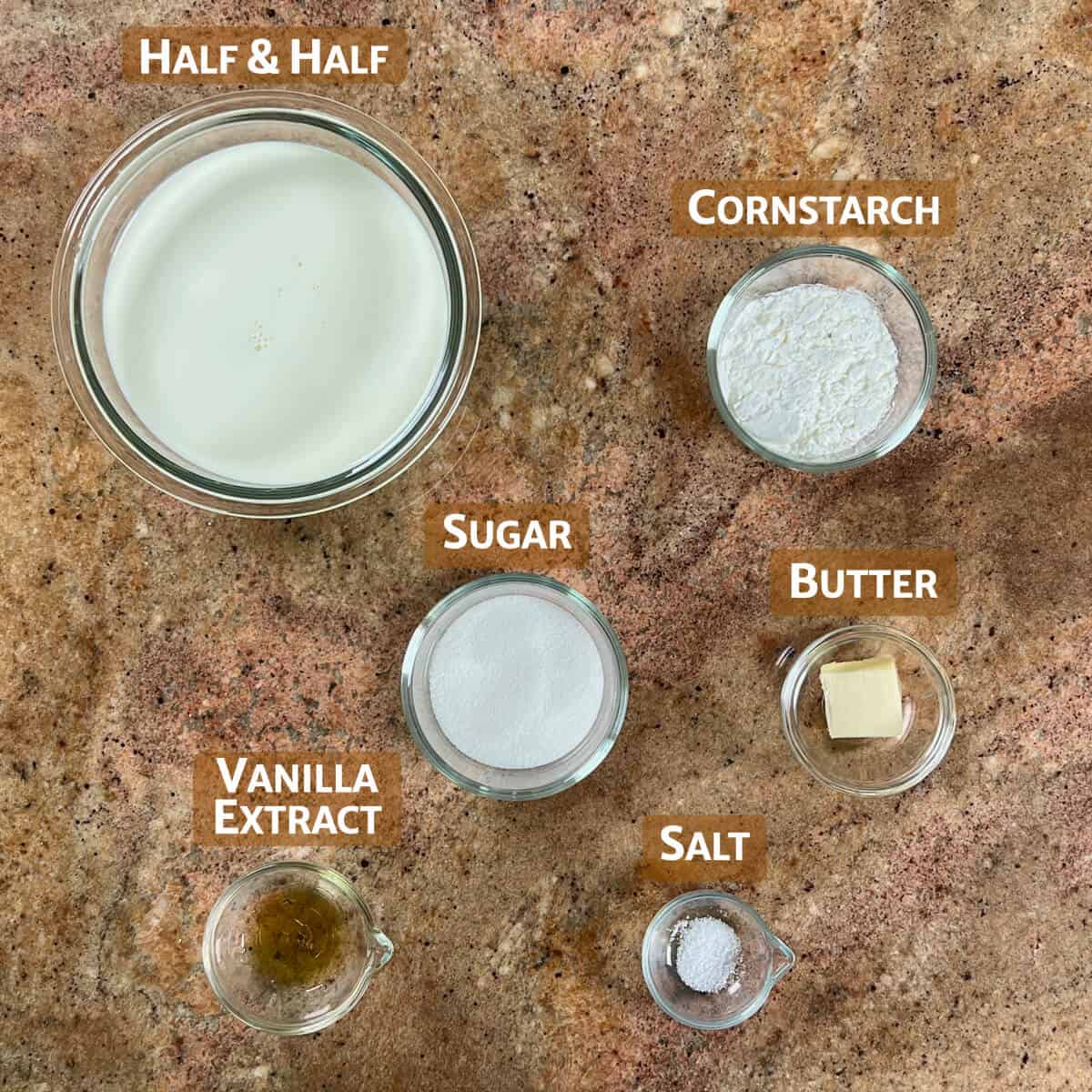 Vanilla pudding ingredients portioned in glass bowls.