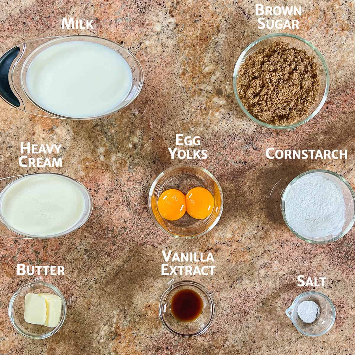 Ingredients for butterscotch pudding portioned into glass bowls.