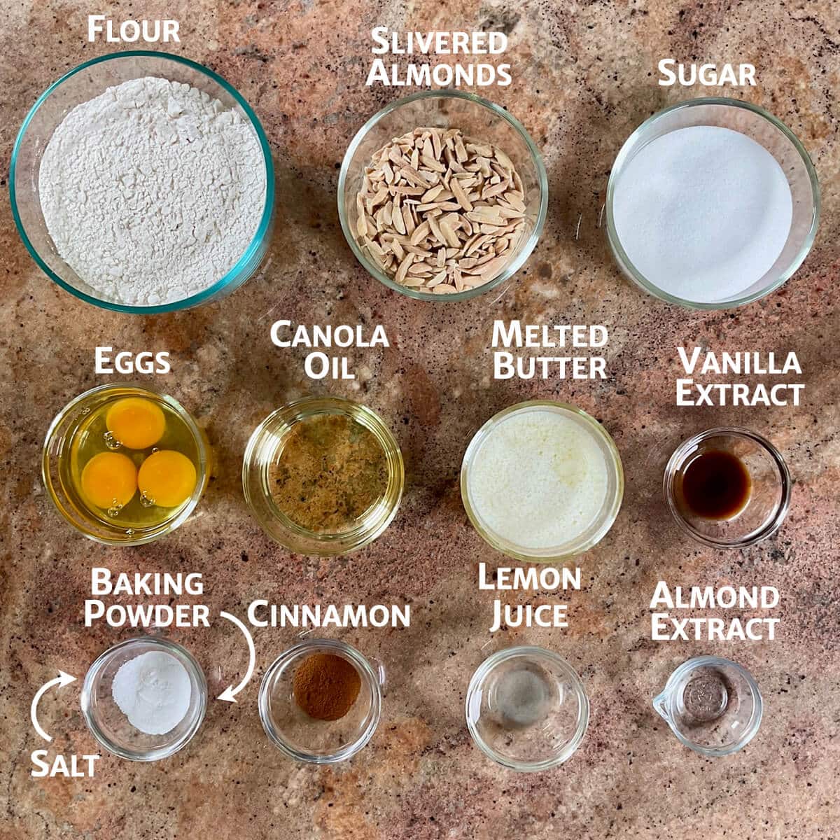 Mandel bread ingredients portioned into glass bowls.