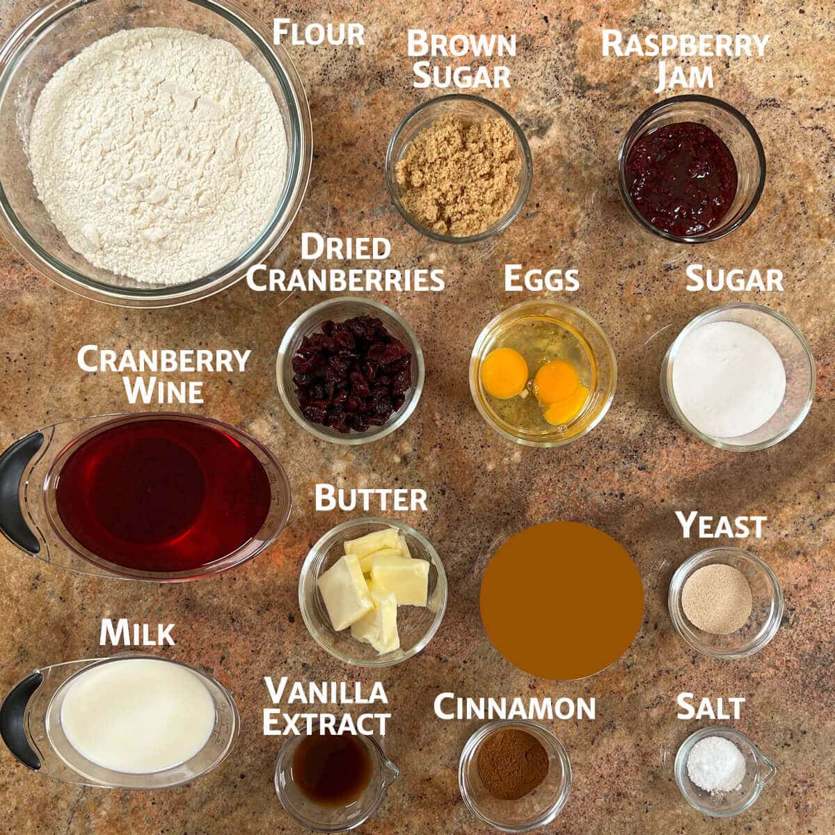 Ingredients for cranberry cinnamon swirl bread portioned into glass bowls.