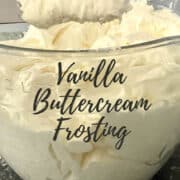 Whipped vanilla buttercream frosting in a bowl with some on a small offset spatula Pinterest banner.