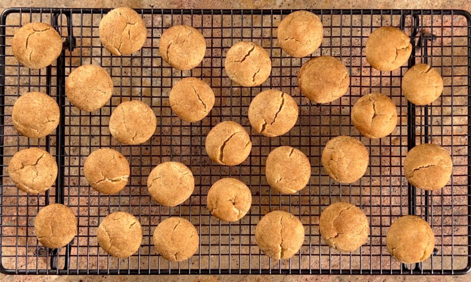 Baked honey cookies on a cooling rack.