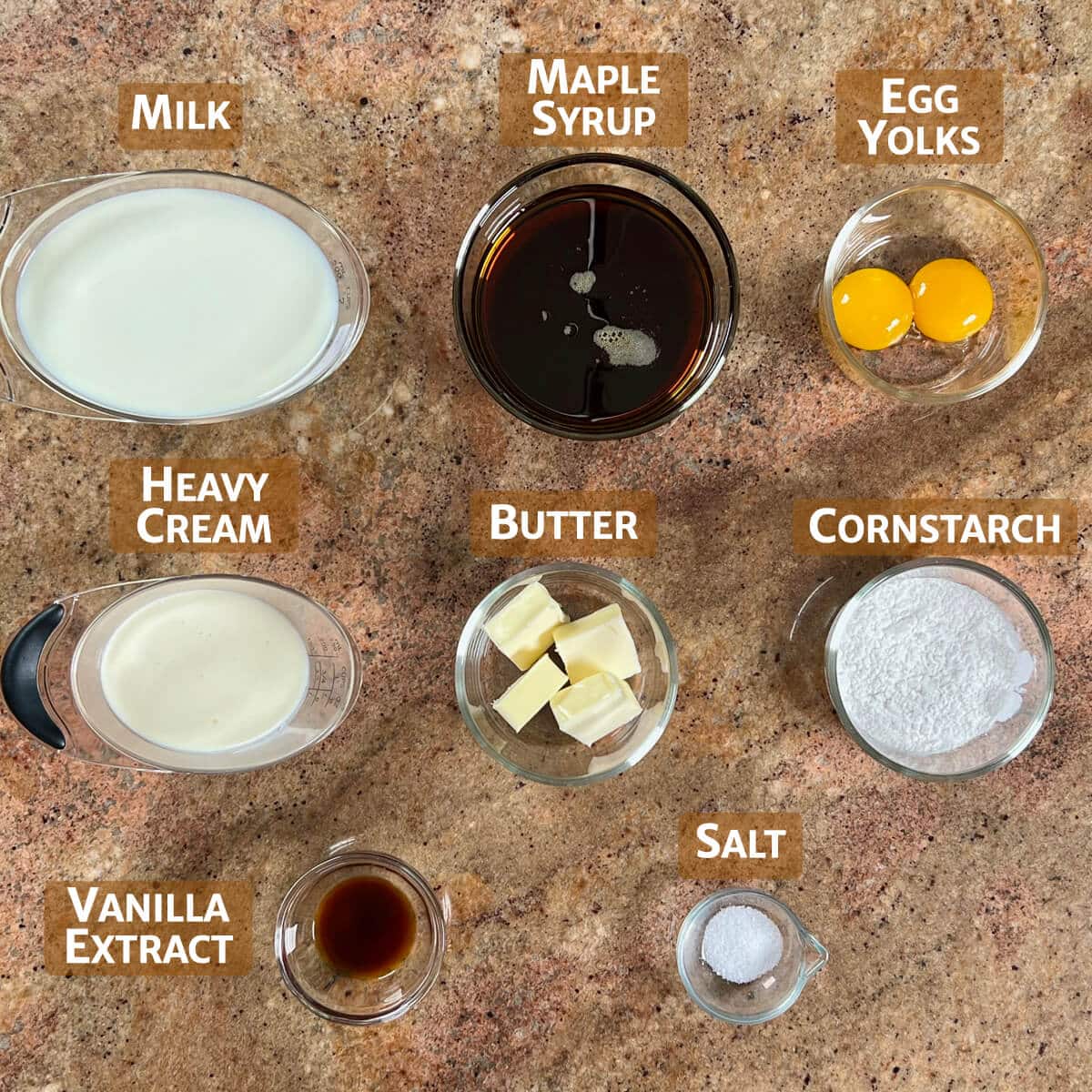 Ingredients for maple pudding portioned into glass bowls.