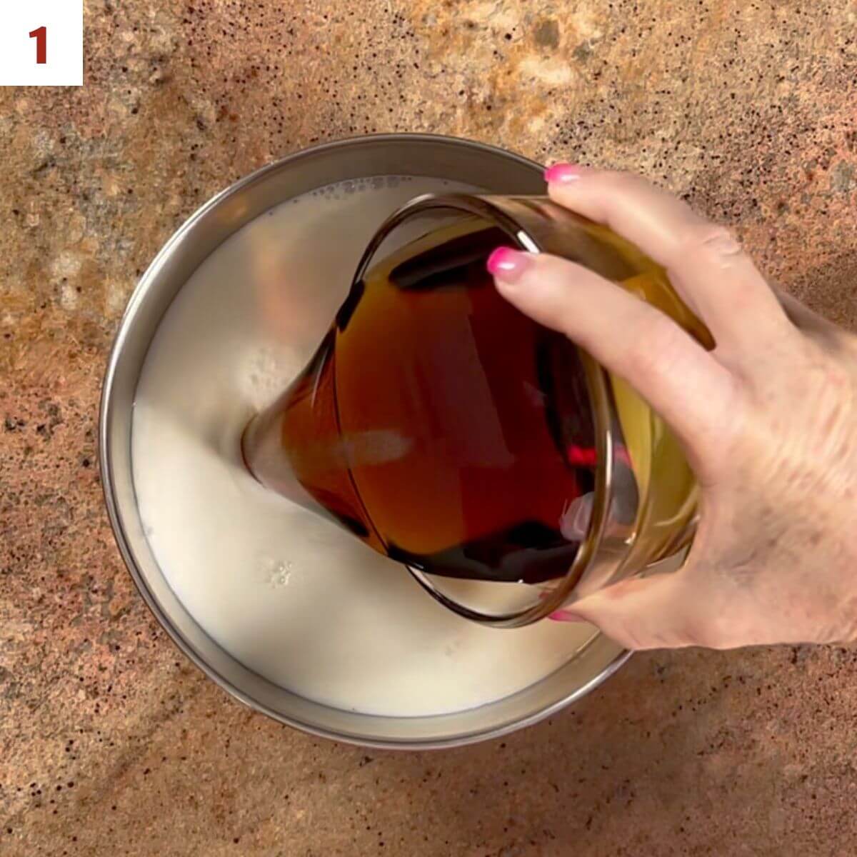 Pouring maple syrup into a saucepan filled with milk.