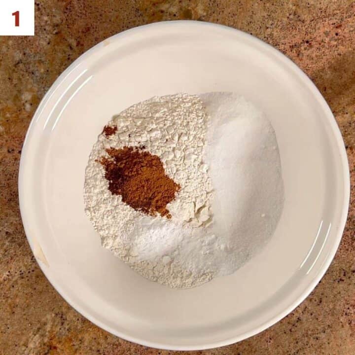 Flour, sugar, baking powder, salt, and pumpkin spices in a large bowl.