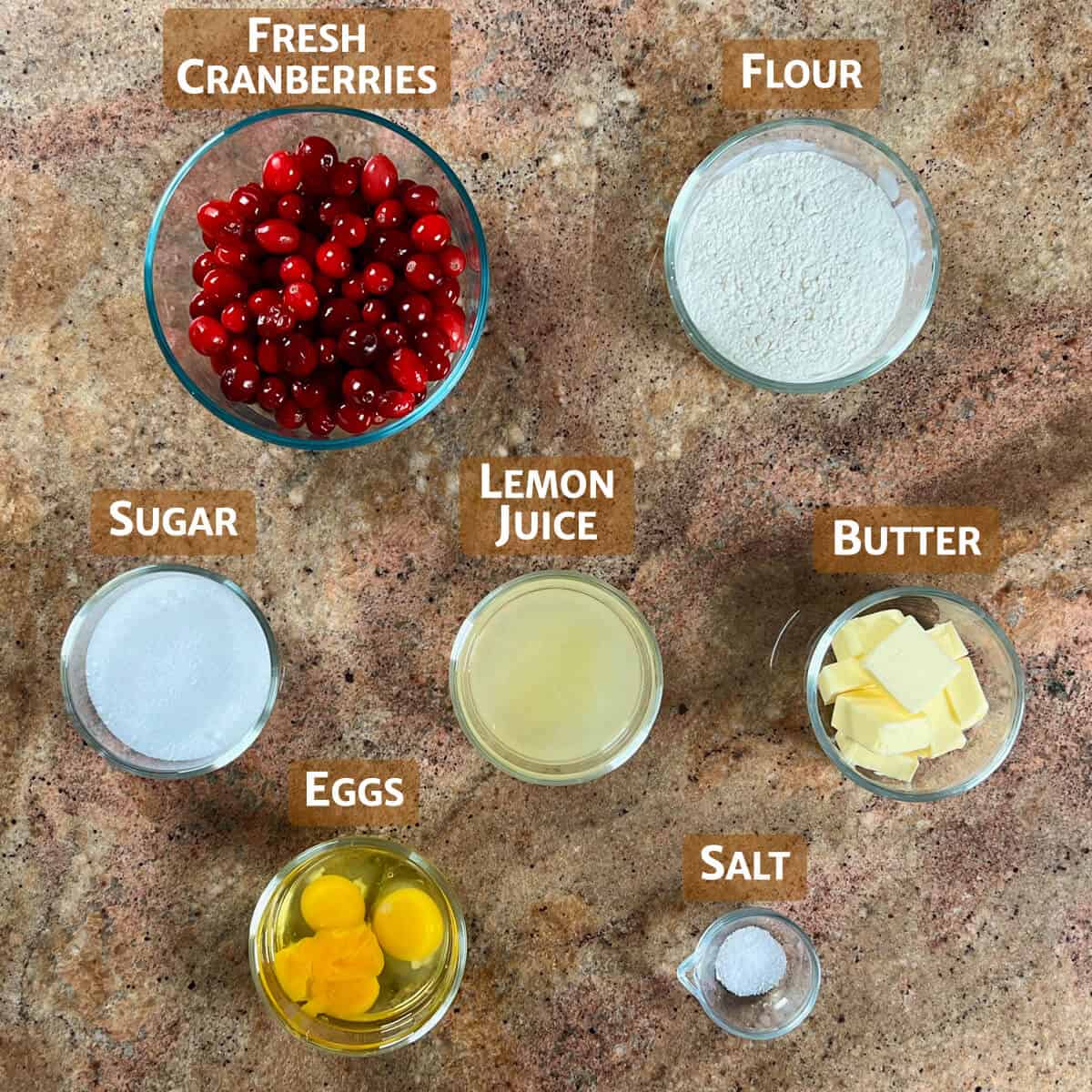 Ingredients for Cranberry Lemon Bars portioned into glass bowls.