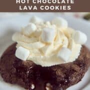 Hot Chocolate Lava Cookie on a white cake plate dripping fudge Pinterest banner.
