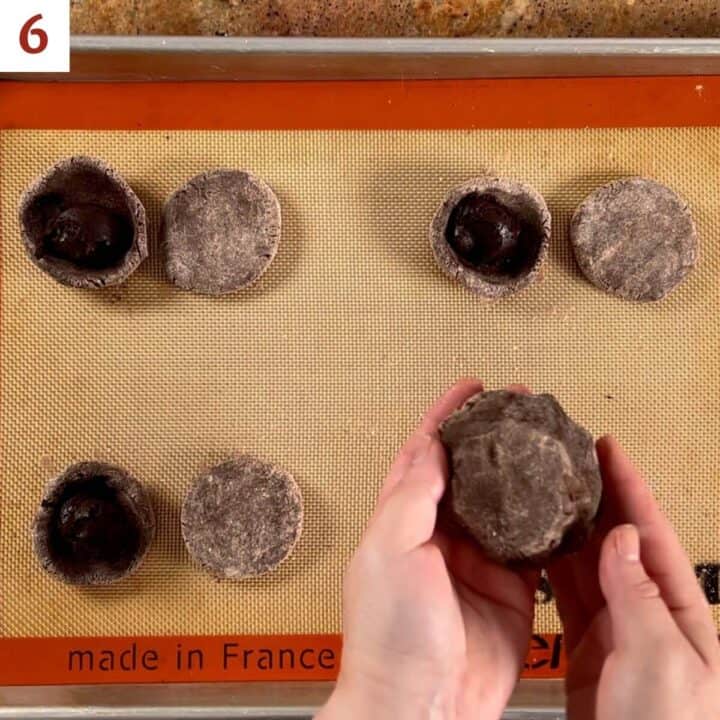 Sealing the flat dough disk over the dough bowl filled with hot fudge.