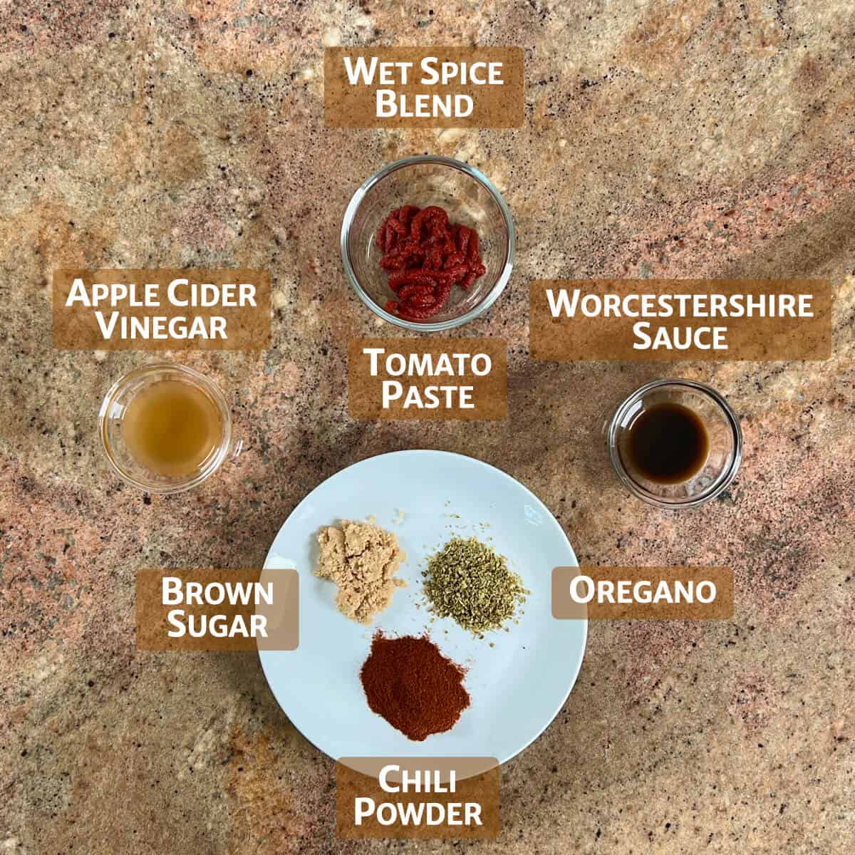 Ingredients for the wet spice blend portioned into glass bowls or on a white plate.