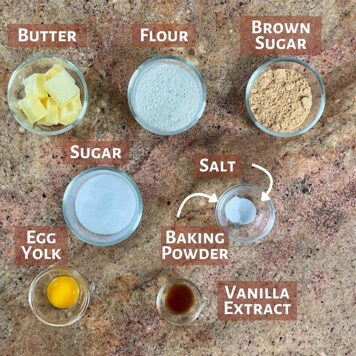 Ingredients for the cookie dough topping portioned into glass bowls.