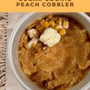 Peach Cobbler in a baking pan with a scoop of vanilla ice cream Pinterest banner.