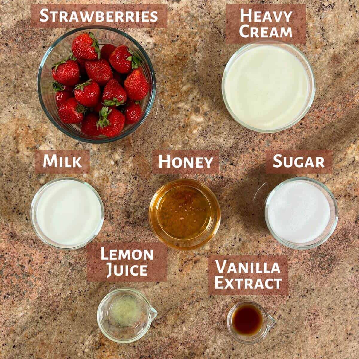 Ingredients for strawberry ice cream portioned into glass bowls.