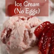 A bowl of strawberry ice cream with strawberries in a glass bowl Pinterest banner.
